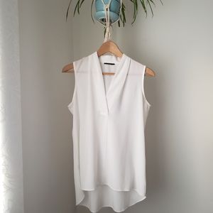 Free with purchase. Sleeveless sheer blouse in white size M like an S.